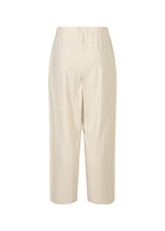The A-POC SHELL pants by PLEATS PLEASE ISSEY MIYAKE are beige, stretchy wide-leg pants with fine pleats and an elastic waistband, shown against a plain white background.