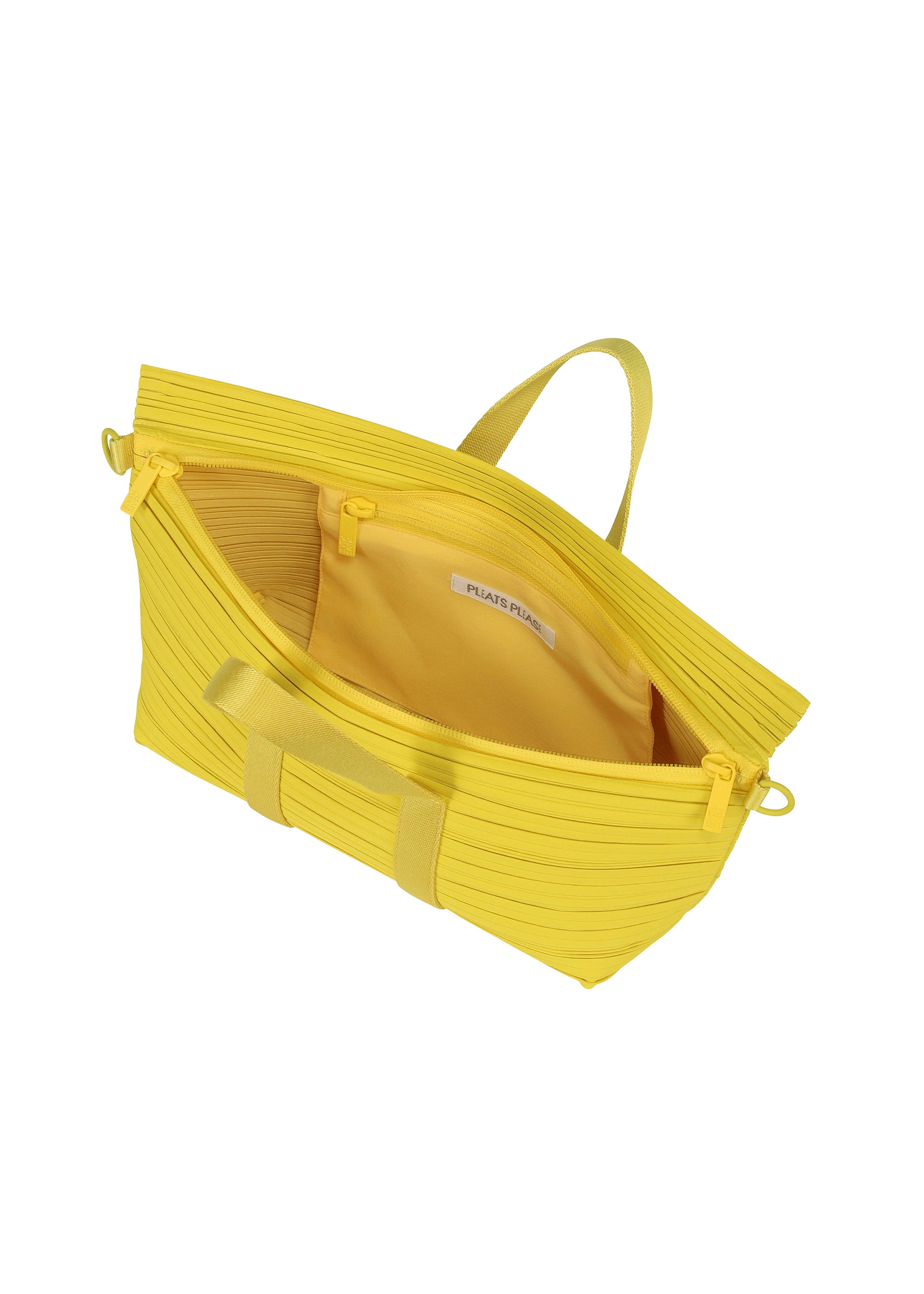 Zoomed view The PLEATS BOSTON BAG by PLEATS PLEASE ISSEY MIYAKE is a bright yellow oblong bag with horizontal pleats and yellow handles, featuring a spacious interior and inside pocket with a white label, shown on a white background.