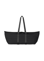 The PP59-AG632 tote bag by PLEATS PLEASE ISSEY MIYAKE features a large, oblong black design with long shoulder straps and a textured surface of horizontal pleats, shown against a white background.