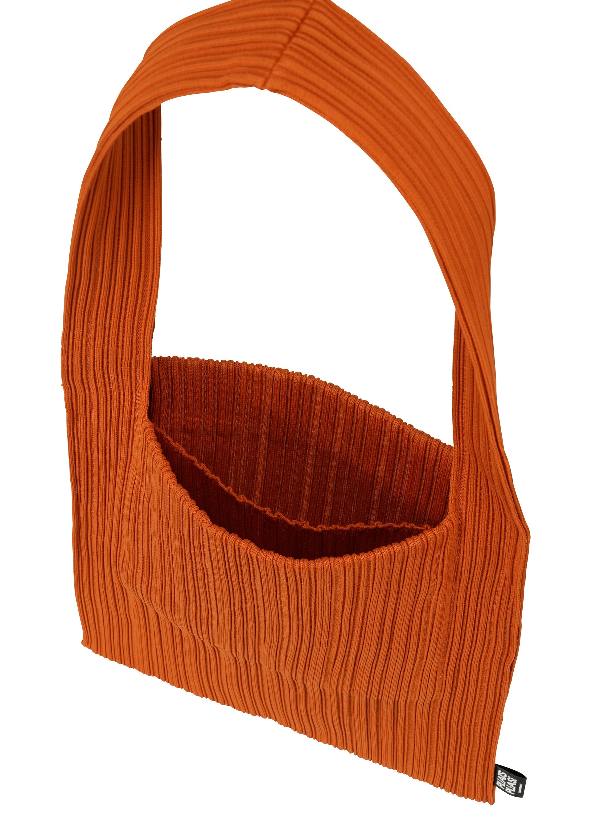 Zoomed view The CREPE KNIT BAG by PLEATS PLEASE ISSEY MIYAKE is a textured orange tote with pleated fabric, horizontal knitting, a wide strap, and open top, shown against a white background.