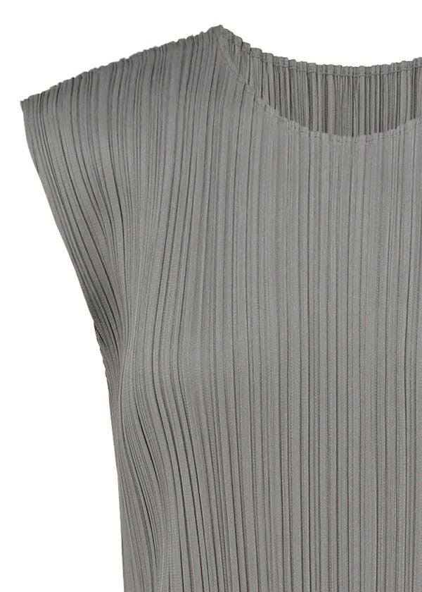 Zoomed view Close-up of the BASICS sleeveless top by PLEATS PLEASE ISSEY MIYAKE in gray, featuring a round neckline and distinctive vertical pleats. The textured fabric offers structure and refined elegance reminiscent of seasonal dress styles. Only the upper portion of this garment is shown.