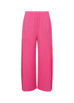 The MONTHLY COLORS : JANUARY wide-leg pleated pants by PLEATS PLEASE ISSEY MIYAKE feature bright pink mid-weight fabric, pockets, and an elastic waistband, shown on a plain white background. - HOT PINK （no.21）