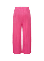 MONTHLY COLORS : JANUARY by PLEATS PLEASE ISSEY MIYAKE—bright pink, mid-weight straight pants with wide-leg pleats, elastic waistband, and pockets. Displayed against a white background.