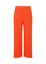The MONTHLY COLORS : FEBRUARY pants by PLEATS PLEASE ISSEY MIYAKE are bright orange, pleated, and straight-leg with an elastic waistband and lightweight fabric, shown against a white background. - RED （no.24）