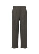 The MONTHLY COLORS : JUNE pants by PLEATS PLEASE ISSEY MIYAKE feature a relaxed wide-leg fit, vertical pleats, side pockets, and an elastic waistband in dark gray, shown on a plain white background for everyday style. - CHARCOAL （no.17）