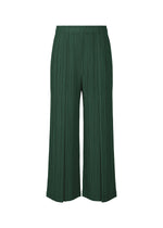 The RAMIE PLEATS pants by PLEATS PLEASE ISSEY MIYAKE are dark green, wide-leg, ankle-length pleated ramie trousers with an elastic waistband, shown on a plain white background. - DARK GREEN （no.67）