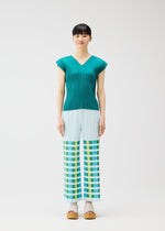 A woman faces forward in the BUMPY BASKET teal pleated short-sleeve top and light blue plaid straight pants with green, yellow, and blue geometric pattern by PLEATS PLEASE ISSEY MIYAKE. She wears beige platform sandals against a plain white background.