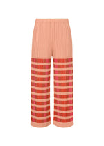 The BUMPY BASKET pants by PLEATS PLEASE ISSEY MIYAKE are peach-colored, wide-leg, and pleated with an embossed pattern, striped pink and red designs on the lower half, side pockets, shown against a white background. - PINK （no.22）