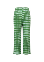 BASKET straight pants by PLEATS PLEASE ISSEY MIYAKE in green and white with a bold block check print, displayed from the front on a plain white background.