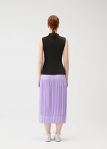 A person with braided hair, seen from behind, wears a sleeveless black top and lilac OPAQUE BOTTOMS by PLEATS PLEASE ISSEY MIYAKE, featuring pleated matte fabric and pockets, paired with white sneakers against a plain white background.