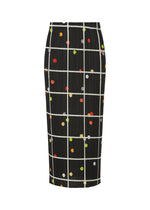 The CROSSING DOTS skirt by PLEATS PLEASE ISSEY MIYAKE features a black base with a white grid and multicolored polka dots in orange, yellow, green, and red. Made from pleated textured fabric, this straight skirt offers dynamic dimension. - BLACK （no.15）