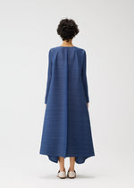 A person with short curly hair faces away, wearing the voluminous CITY FRAME blue dress with long sleeves by PLEATS PLEASE ISSEY MIYAKE. Light flat shoes complete the look against a plain white background.