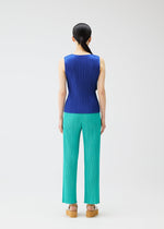A person faces away against a white background, wearing PLEATS PLEASE ISSEY MIYAKE's MONTHLY COLORS : MAY—a sleeveless blue tank top with subtle gradations, teal pleated pants, and tan platform sandals. Their dark hair is tied back for a chic summer look.