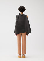 A person with short curly hair faces away, wearing the BOUNCY BASKET sleeveless top by PLEATS PLEASE ISSEY MIYAKE, styled with light brown pleated pants and platform sandals, set against a plain white background.