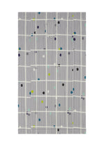 CROSSING DOTS by PLEATS PLEASE ISSEY MIYAKE is a gray plastic bag with plaid and colorful dots in green, blue, yellow, and purple over a white grid. It features a die-cut handle at the top center.