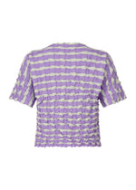 The TWIST KNIT by PLEATS PLEASE ISSEY MIYAKE is a short-sleeved knit top in lilac and white stripes, featuring a textured ruched pattern, shown from the back.
