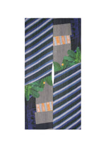 The CITY COLLAGE MADAME-T by PLEATS PLEASE ISSEY MIYAKE features abstract art with blue and white diagonal stripes, gray lines, green leaf shapes, and orange accents split by a central curved gap for a mirrored collage effect. - GRAY×NAVY （no.09）