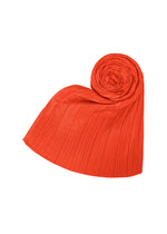 The MADAME-T FEBRUARY stole by PLEATS PLEASE ISSEY MIYAKE is elegantly shaped into a heart, one end spiraled and the other fanned out, its bright red pleats vividly contrasting with the plain white background.