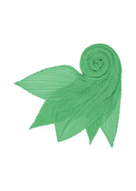 The MONTHLY SCARF MARCH by PLEATS PLEASE ISSEY MIYAKE is a light green, pleated scarf with pointed ends, spiraled to evoke stylized leaves or petals against a white background, capturing spring mountain freshness.