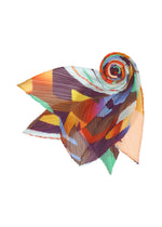 The PLAYGROUND SCARF by PLEATS PLEASE ISSEY MIYAKE features a bold geometric print with pleated, fan-like shapes in orange, purple, blue, green, and yellow on a white background.