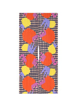 The MARKET MADAME-T by PLEATS PLEASE ISSEY MIYAKE is a rectangular pleated stole with a bold paper cutting print—red, yellow, pink, and purple shapes on a black-and-white grid—featuring striking vertical pleats. - TOMATO （no.97）