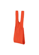 The PLEATS PLEASE ISSEY MIYAKE PLEATS BRIDGE BAG is a bright orange tote with wide handles, distinctive pleated details, and is shown against a plain white background. - RED （no.24）