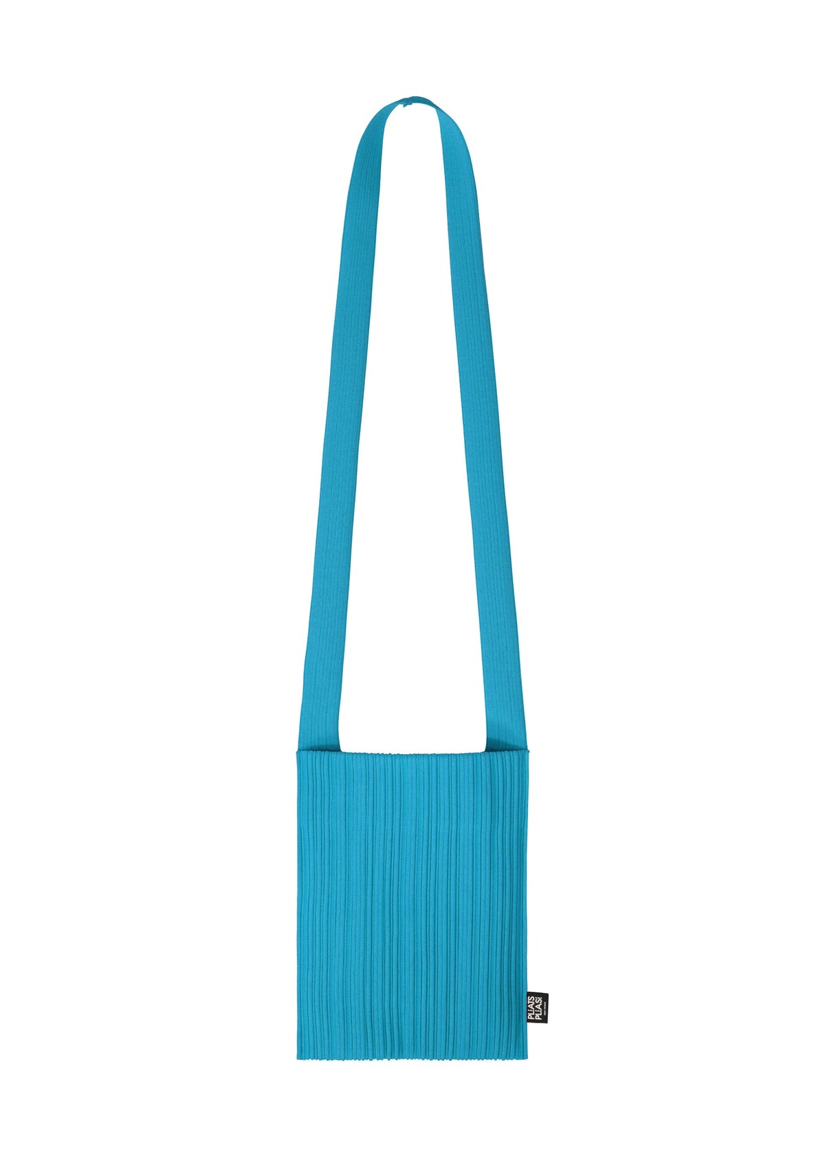 The CREPE KNIT BAG by PLEATS PLEASE ISSEY MIYAKE is a bright blue, rectangular pleated bag with a wide matching strap and a black label, shown on a white background. Washable and practical, it’s both stylish and functional. view 3 of 6