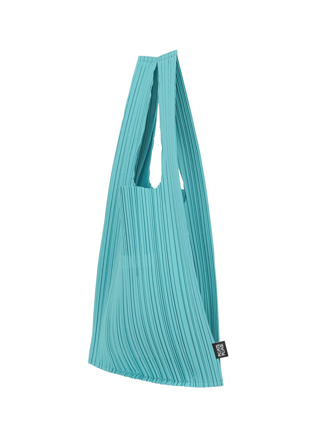 The PLEATS SHOPPING TOTE by PLEATS PLEASE ISSEY MIYAKE is a turquoise pleated bag with two handles and a small black label near the bottom, shown against a white background. view 3 of 4