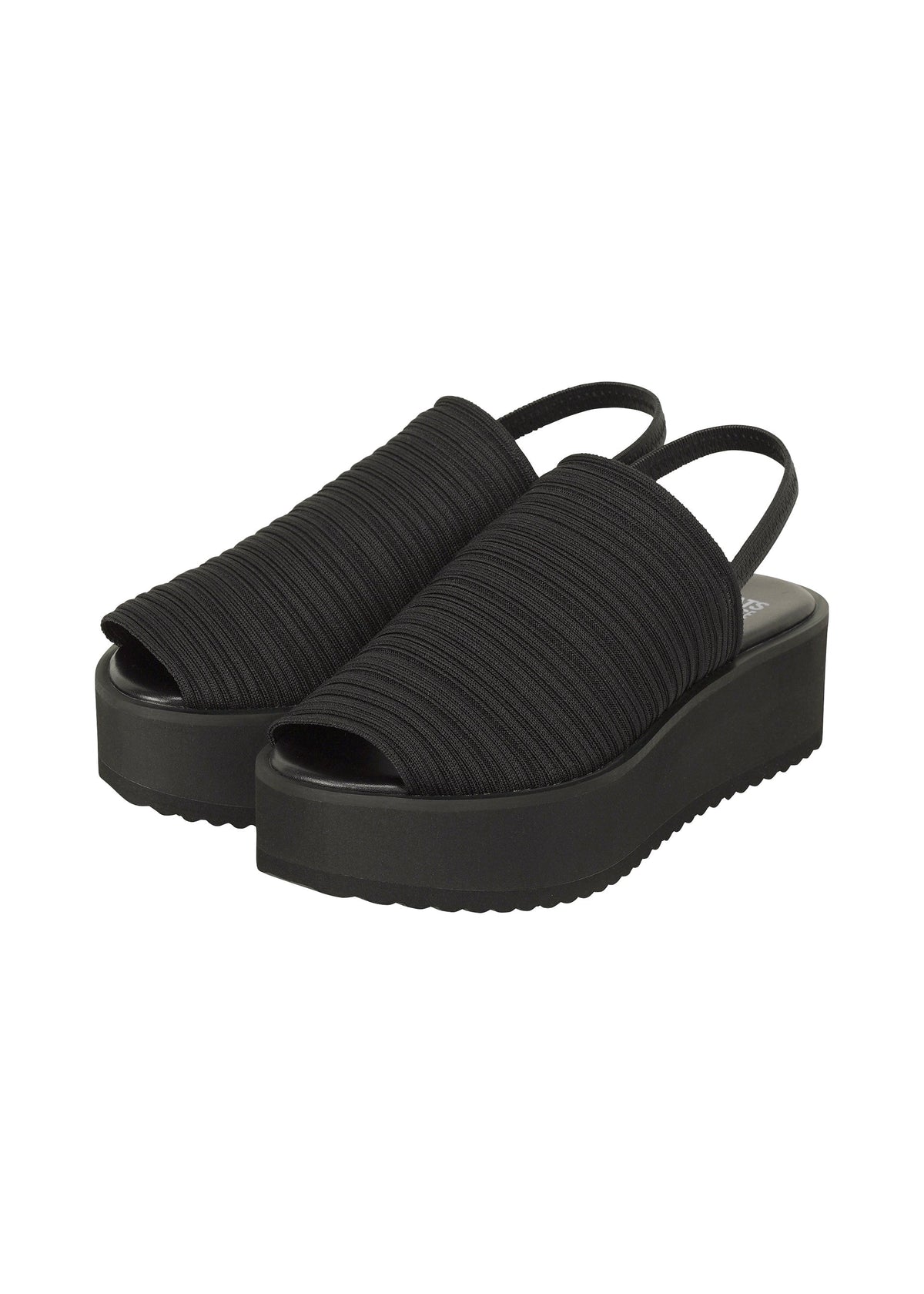 The PLEATS KNIT SANDALS by PLEATS PLEASE ISSEY MIYAKE feature black ribbed fabric uppers with pleat lines, open toes, slingback straps, and thick solid black soles. view 1 of 10