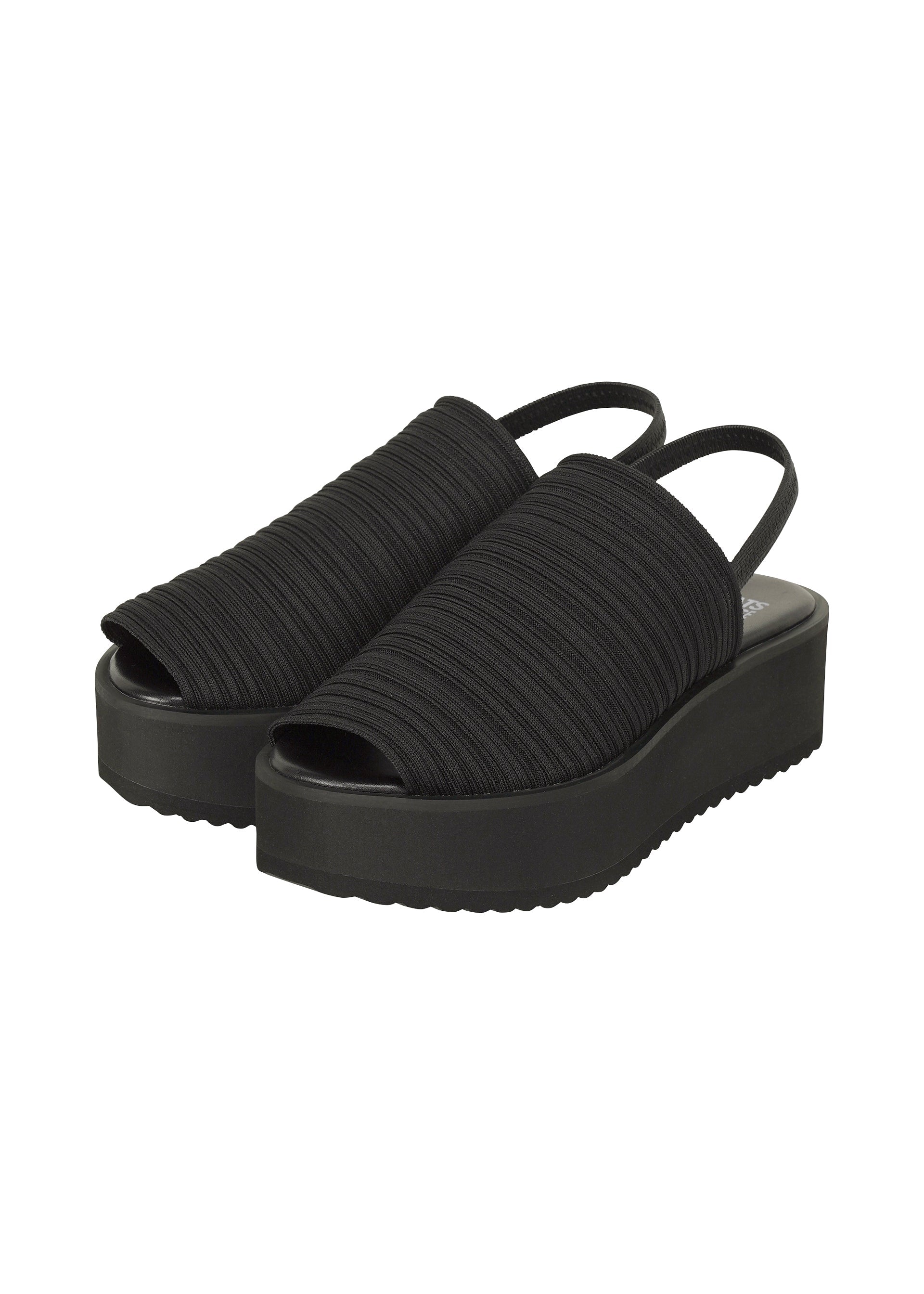 Zoomed view The PLEATS KNIT SANDALS by PLEATS PLEASE ISSEY MIYAKE feature black ribbed fabric uppers with pleat lines, open toes, slingback straps, and thick solid black soles. - BLACK （no.15）
