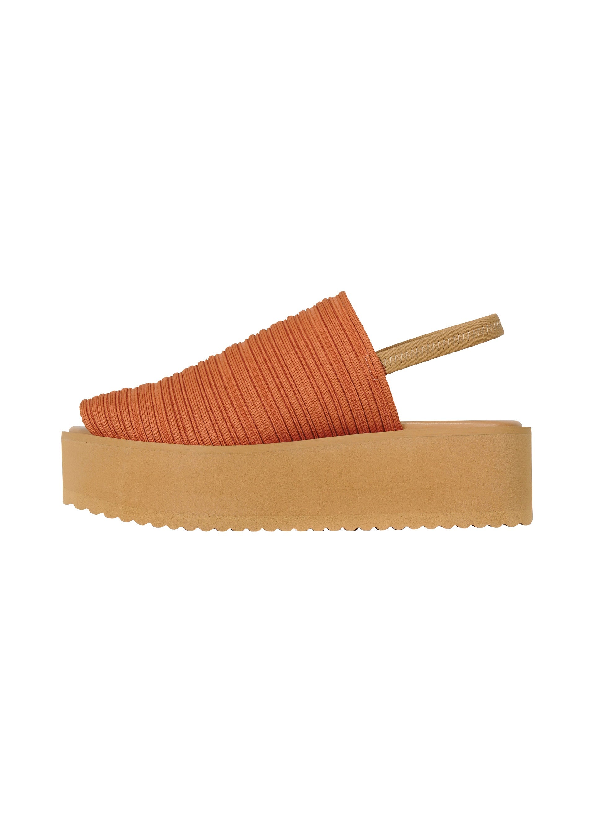Zoomed view The PLEATS PLEASE ISSEY MIYAKE PLEATS KNIT SANDALS feature orange textured knit, pleat lines, a thick beige platform sole, and a beige elastic heel strap, shown in side profile against a white background.
