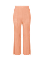 The MONTHLY COLORS : JULY peach-colored flare pants by PLEATS PLEASE ISSEY MIYAKE feature a high waist, pleated design, and convenient pockets, shown on a white background for a modern twist on colorful pants. - PALE ORANGE （no.30）