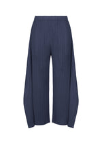 The MONTHLY COLORS : SEPTEMBER pants by PLEATS PLEASE ISSEY MIYAKE feature a navy blue hue with pleated wide-leg flare design, an elastic waistband, straight cut, and extra fabric draping along the sides. Displayed on a white background, the gentle tones of the color composition enhance their elegant silhouette. - NAVY BLUE （no.76）