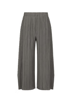 MELLOW PLEATS pants by PLEATS PLEASE ISSEY MIYAKE, shown on a white background, feature a wide-leg, cropped silhouette with an elastic waistband. Crafted from soft mid-weight fabric, these loose-fitting gray pants are distinguished by their vertical textured pleats and flared shape. - CHARCOAL （no.17）