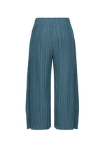 The MELLOW PLEATS pants by PLEATS PLEASE ISSEY MIYAKE are wide-leg, teal-colored trousers crafted from a soft-textured, mid-weight fabric with an elastic waistband, showcased against a plain white background.