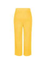THICKER BOTTOMS 1 by PLEATS PLEASE ISSEY MIYAKE are yellow pleated wide-leg pants made from mid-weight fabric with an elastic waistband, shown against a plain white background.