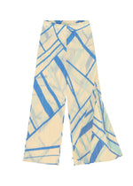 The FOLD LINE pants by PLEATS PLEASE ISSEY MIYAKE feature a cream base with a blue abstract diagonal wrapping pattern, wide legs, pleats, and a high-waisted, minimalist design.
