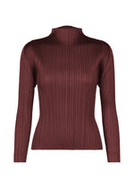The FLUTTER top by PLEATS PLEASE ISSEY MIYAKE is a long-sleeve, dark maroon sweater featuring a mock neck and an elegant fitted silhouette, distinguished by its signature ribbed, vertically pleated texture—a sophisticated choice for any women’s wardrobe. - BORDEAUX （no.84）
