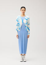 A woman stands facing forward, wearing the FOLD LINE long light blue pleated dress by PLEATS PLEASE ISSEY MIYAKE, styled with a minimalist white cardigan featuring blue stripes and paired with white lace-up boots, against a plain light background.