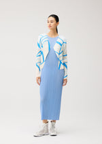 A woman stands against a plain background, wearing the FOLD LINE long light blue pleated dress by PLEATS PLEASE ISSEY MIYAKE, paired with a white and blue minimalist patterned cardigan and white high-top sneakers. She looks slightly to the side with her hands at her sides.
