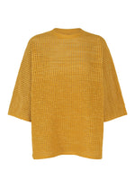 The DOT KNIT by PLEATS PLEASE ISSEY MIYAKE is a mustard yellow, loose-fit, open-knit sweater with a mesh pattern, wide sleeves, and round neckline shown on a white background. - OCHER （no.54）