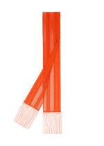 A-POC LACE scarf by PLEATS PLEASE ISSEY MIYAKE, featuring a long, narrow silhouette in orange with vertical stripes, mesh texture, and fringe at both ends, displayed flat on a white background.