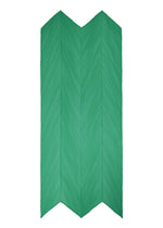 The MONTHLY SCARF JULY by PLEATS PLEASE ISSEY MIYAKE features a green, zigzag-folded, chevron leaf pattern with a woven-like texture and slightly uneven edges.