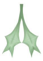 Two green, webbed shapes resembling stylized leaves or wings are joined at the top, fanning out into three pointed tips on each side against a white background—evoking the elegant folds of the FOLD HOOD SCARF by PLEATS PLEASE ISSEY MIYAKE.