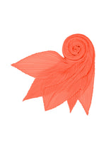 The MONTHLY SCARF SEPTEMBER by PLEATS PLEASE ISSEY MIYAKE, in a coral hue, is intricately pleated and folded into a spiral with pointed ends, evoking the form of a stylized flower or leaf against a white background. Its soft color and delicate texture create an elegant stole-like appearance, ideal for adding sophistication to any outfit.