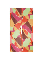 SURPRISE! MADAME-T by PLEATS PLEASE ISSEY MIYAKE features abstract artwork with torn, colorful shapes in red, orange, green, pink, and brown—arranged symmetrically on a vertical canvas with a central slit dividing the composition—evoking a paper tearing pattern reminiscent of the textured folds in a pleated stole. - ORANGE （no.32）