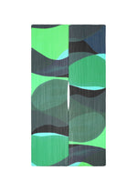 ORBIT MADAME-T by PLEATS PLEASE ISSEY MIYAKE: A rectangular textile piece with abstract green, teal, blue, and black shapes, vertical slit, and pleats throughout. Features a large stole style on a white background. - GREEN （no.62）