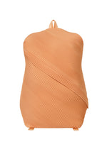 The BIAS PLEATS BACKPACK by PLEATS PLEASE ISSEY MIYAKE features a peach color, diagonal pleats, and a unique wavy texture with minimalist design, shown against a white background. - PALE ORANGE （no.30）