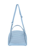 The BIAS PLEATS BAG by PLEATS PLEASE ISSEY MIYAKE is showcased against a plain white background, featuring light blue diagonal pleating, an adjustable shoulder strap, two handles, and a zippered front pocket. - LIGHT BLUE （no.70）