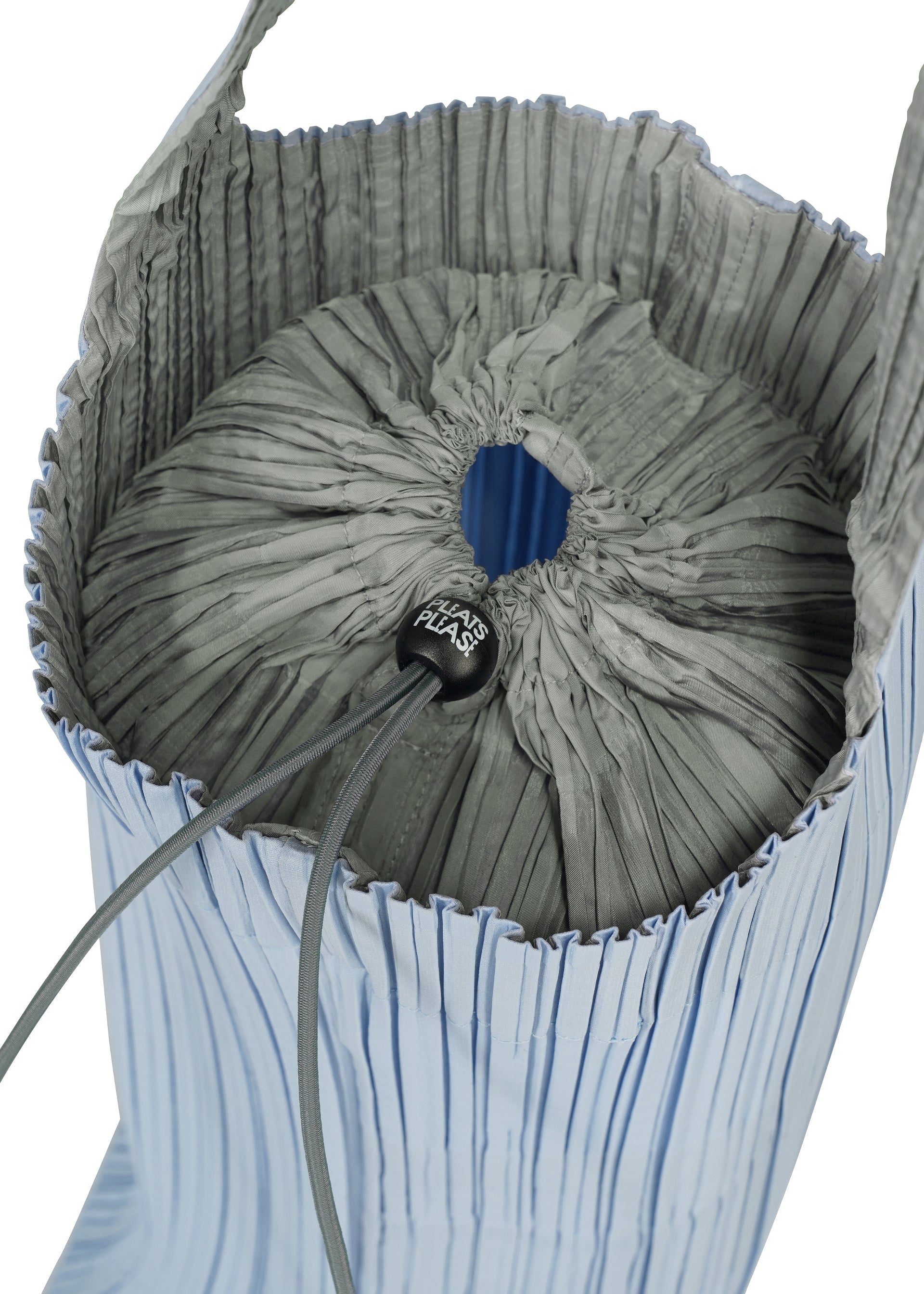 Zoomed view A close-up of the PLEATS SWAN BAG by PLEATS PLEASE ISSEY MIYAKE reveals its pleated design and drawstring closure, highlighted by a black toggle with white text. This elegant handbag boasts a light blue exterior and gray interior, seamlessly blending style and functionality in one sophisticated accessory.